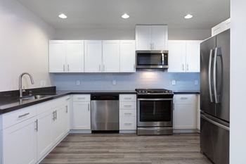 Unfurnished kitchen with stainless steel appliances